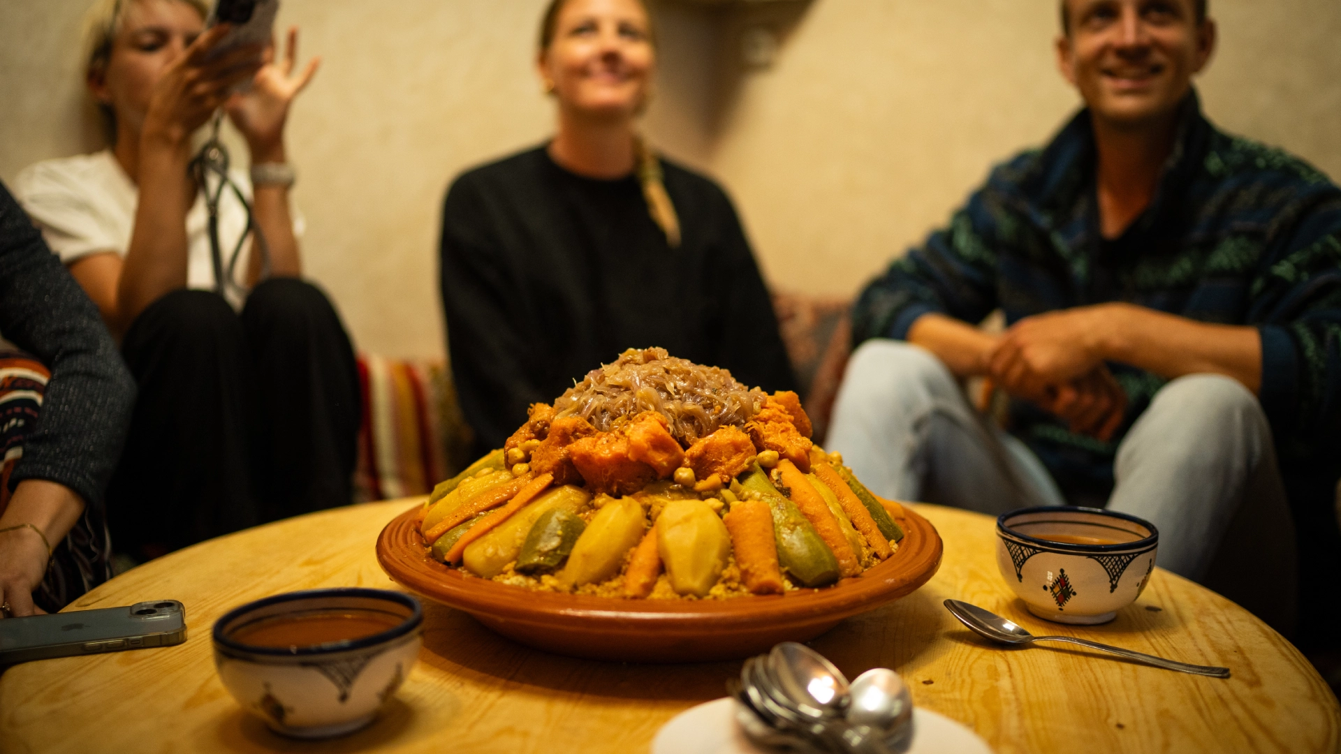 Participants savour a traditional Moroccan meal after a surf session.
